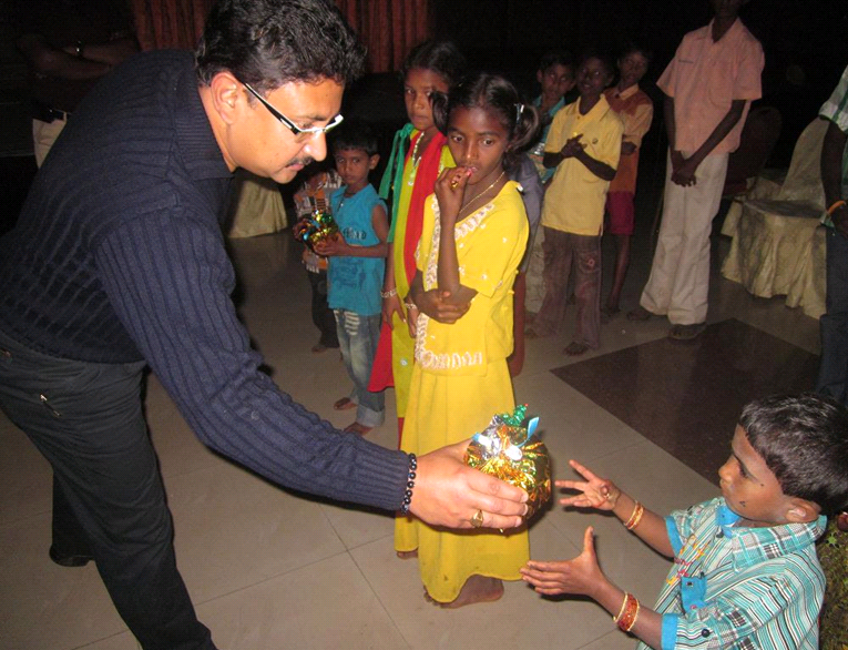 Children receiving christmas gift-Sterling Holidays