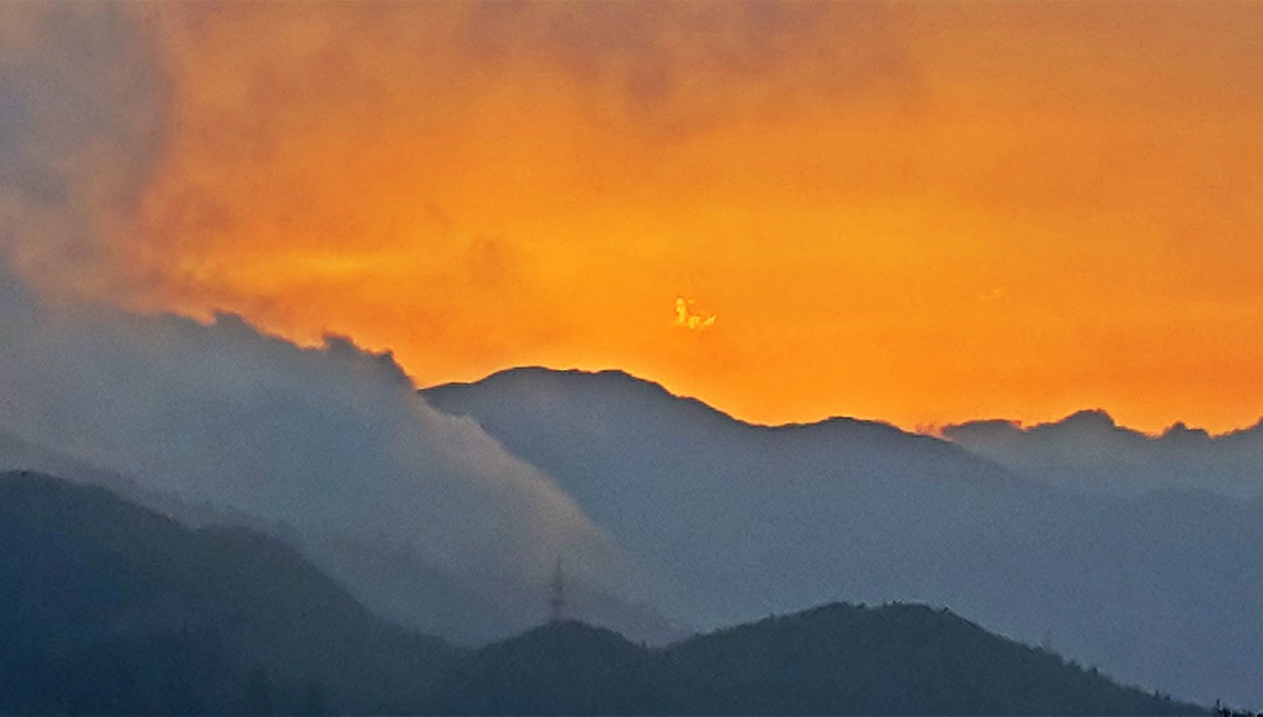 Afterglow - the Kanchenjunga range playing hide and seek with the coloured sky