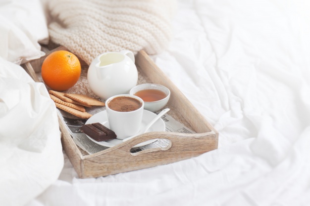 breakfast-tray-with-a-coffee-and-an-orange_1220-631