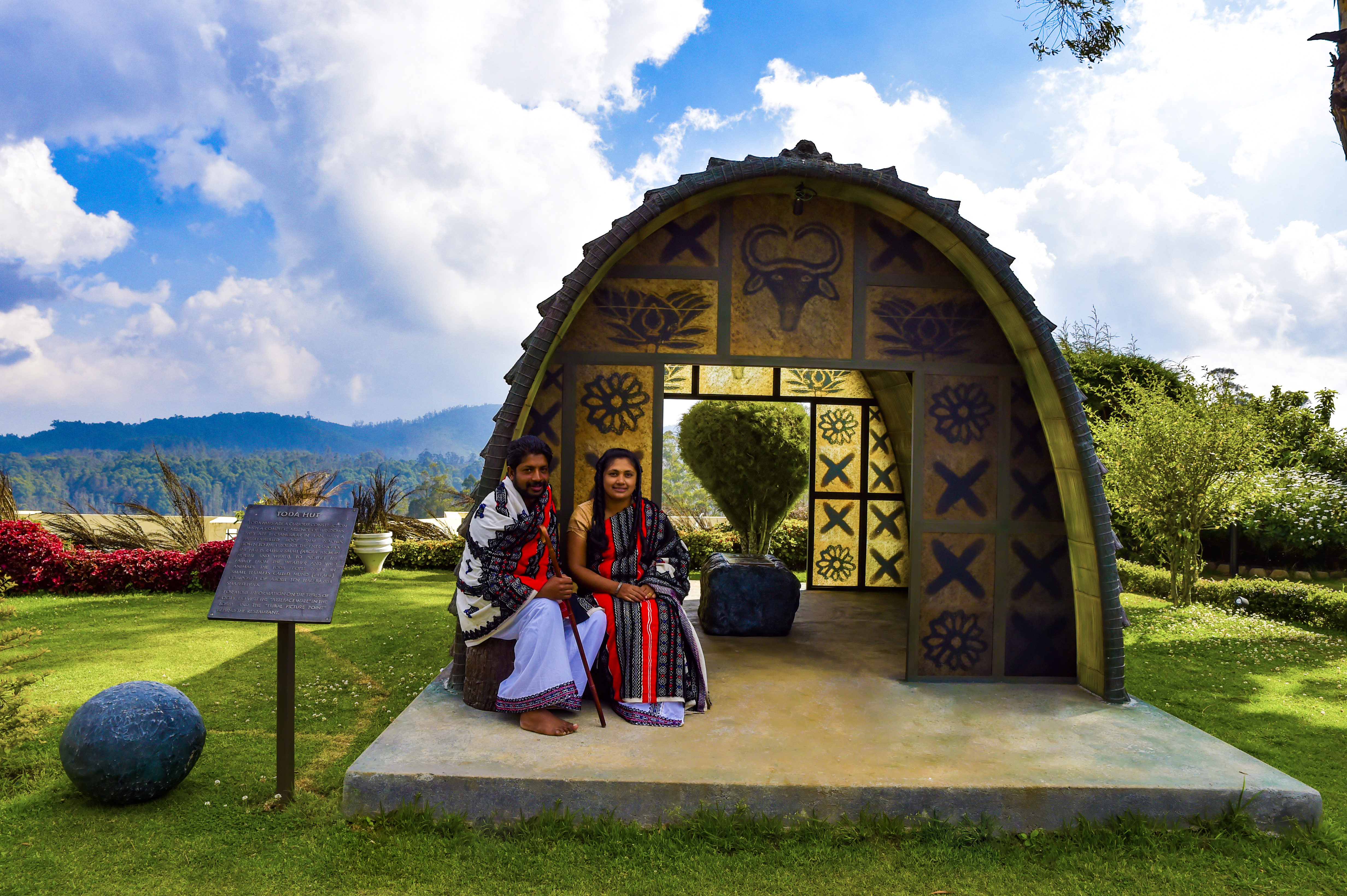 A Couple In Traditional Toda Attire With The Wedding Stone